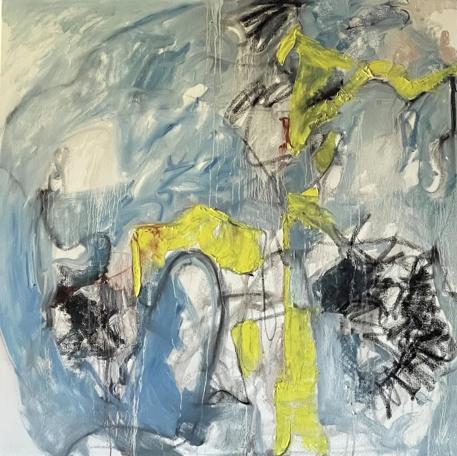A painting of a horse and rider in the background.