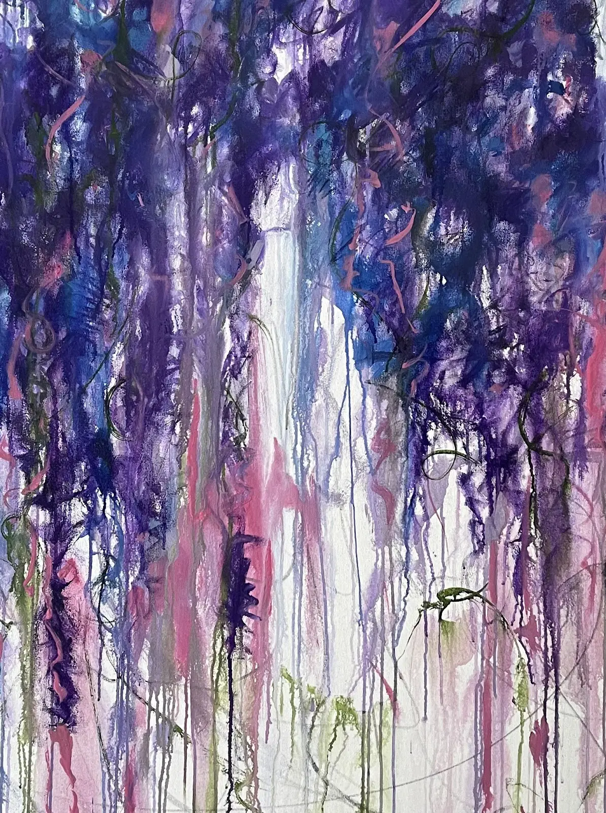 A painting of purple and blue flowers on the side.