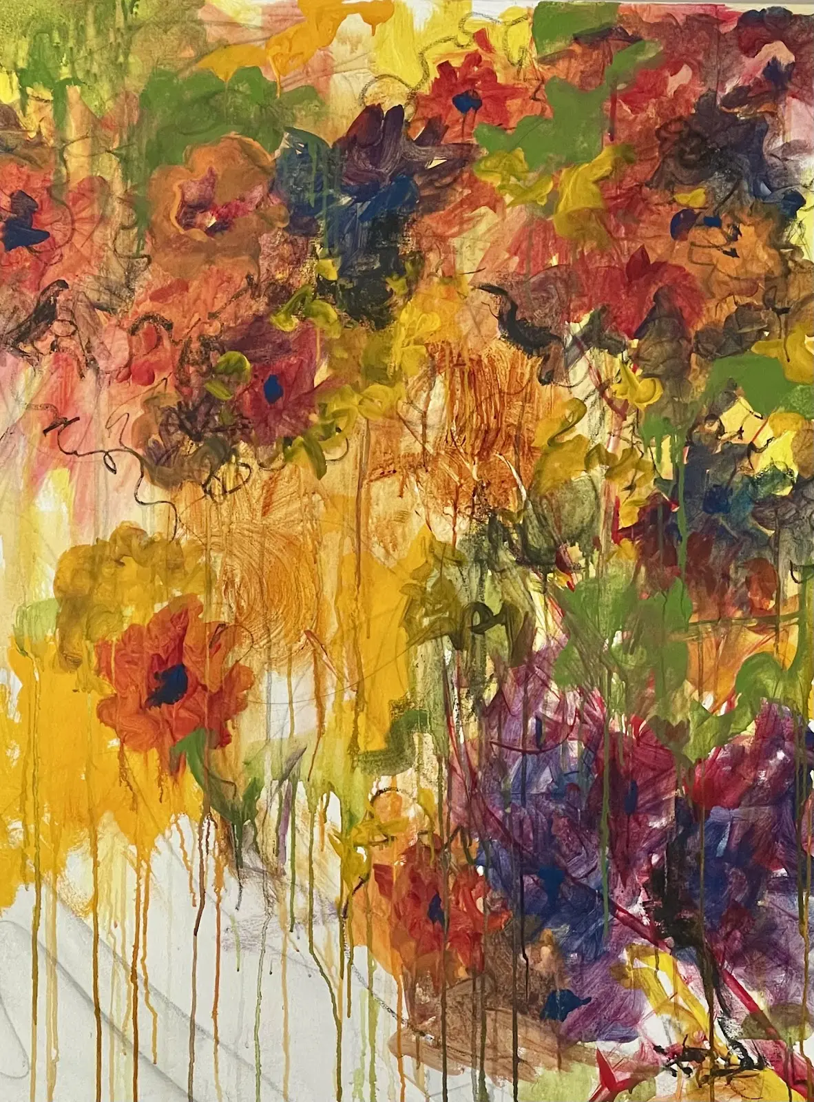 A painting of flowers in the background and yellow, red, purple, green and white.